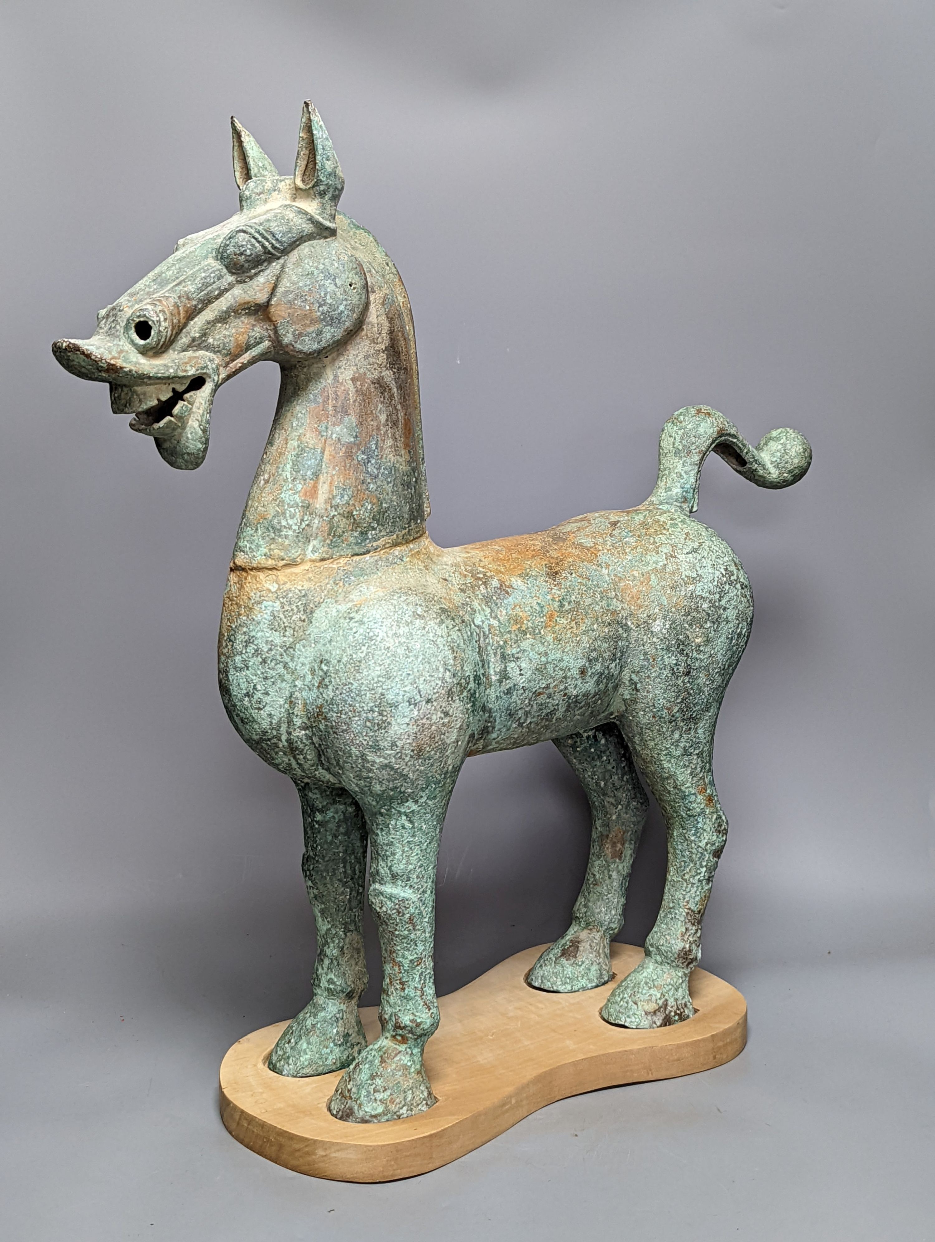A large Chinese bronze figure of a horse, Han style 58cm
